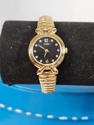 Vintage Timex Gold Toned Stretch Watch with Black Face & Crystals For Hours