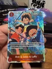 One Piece OP13-007 Ace & Sabo & Luffy SR (Alternate Art) Carrying On His Will NM