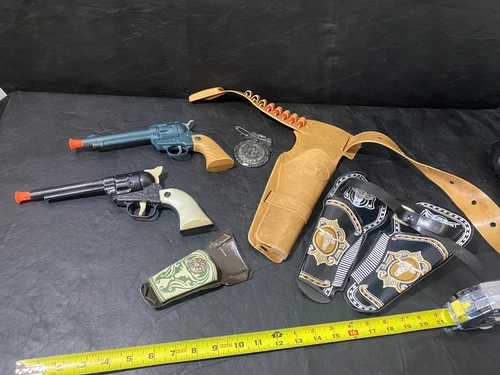 vintage Marx plastic holsters and guns TOYS that make click noise