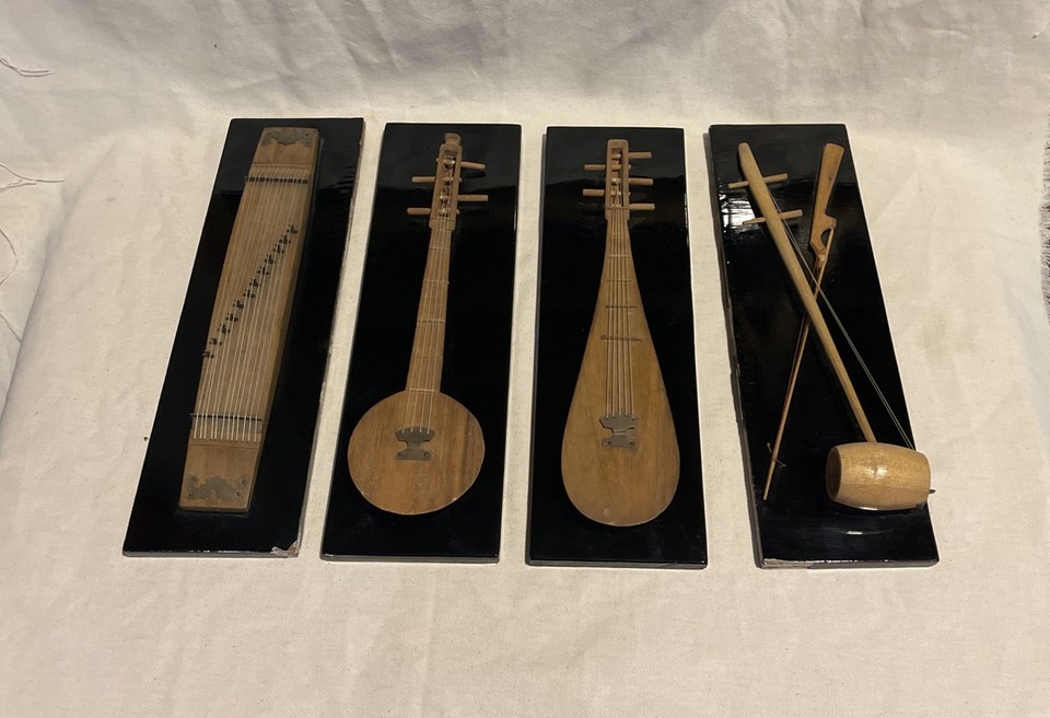 Four handmade Korean wooden miniature musical instruments as wall art — a genuinely one-of-a-kind vintage set with real craft and cultural storytelling built in.