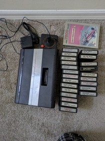 working Atari 7800 console with 23 games, joystick, and PSU.