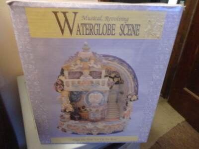 MUSICAL REVOLVING WATER GLOBE SCENE PLAYS THE TUNE ''LA VIE EN ROSE''