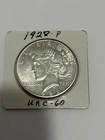 1928 P mint Peace Silver Dollar very good condition with sheen & details visible