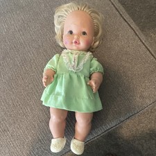 Vintage Blonde Curly Hair Baby Doll in Green Dress with White Shoes and Pink Bow