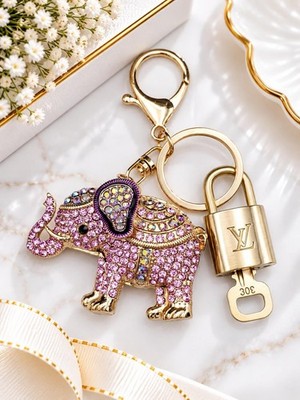 Louis Vuitton Gold Lock   Authentic LV Key + Unbranded Elephant Bag Charm