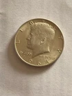 1964 Kennedy, and a 49 Franklin, silver 50 cents B/U,A/U nice coins, fast ship!