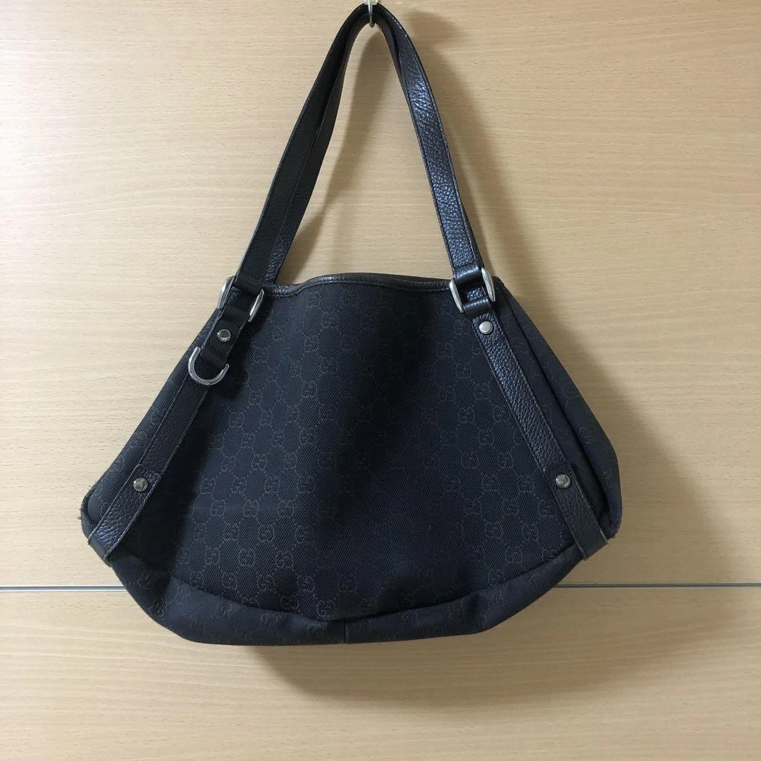 Sac à main bandoulière Gucci marron Gg toile marron foncé bordure cuir créateur