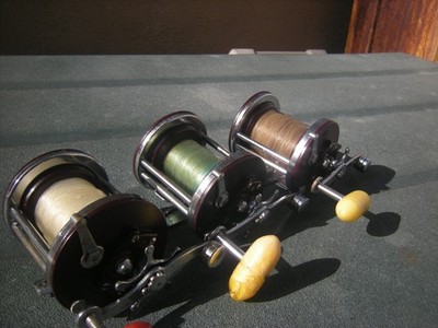 A SET OF 3 VINTAGE PENN JIGMASTER 500 REELS  -  USA