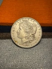(#102036) Morgan Dollar: 1887 O.  Better date.  AU.  Luster.  (see video!)