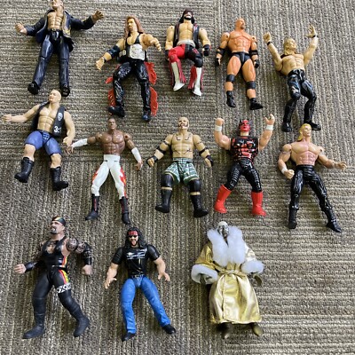 Lot of 13 WWE Wrestlers Action Figures Toy Biz The Rock WCW Stone