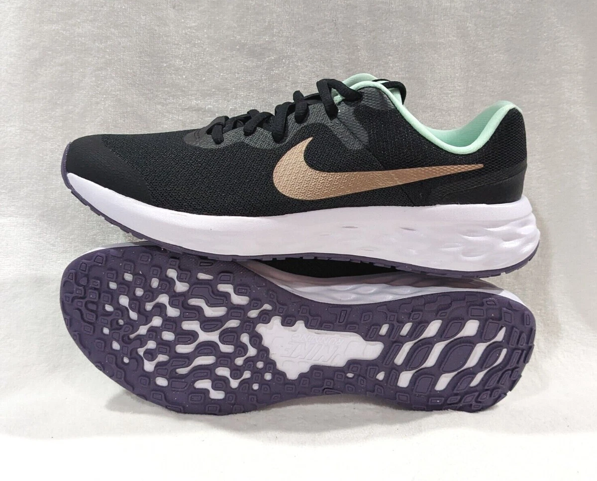 Nike black and hotsell gold trainers womens