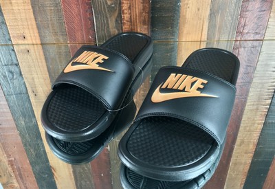 blue and gold nike slides
