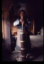 Woman churning yak-butter tea,Sikkim,India,A Tour of the Lost Kingdom,Churn