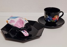 Kaffeeservice 6 personen schwarz mit buntem Rand an den Tassen.