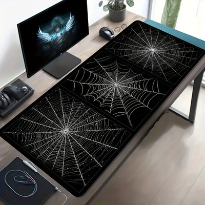A Large Gaming Mouse Pad Featuring a Black And White Spider Web Art Design, wit