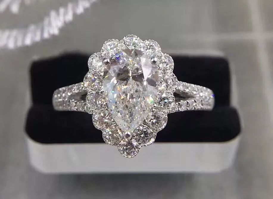 Pear shaped split store shank diamond ring