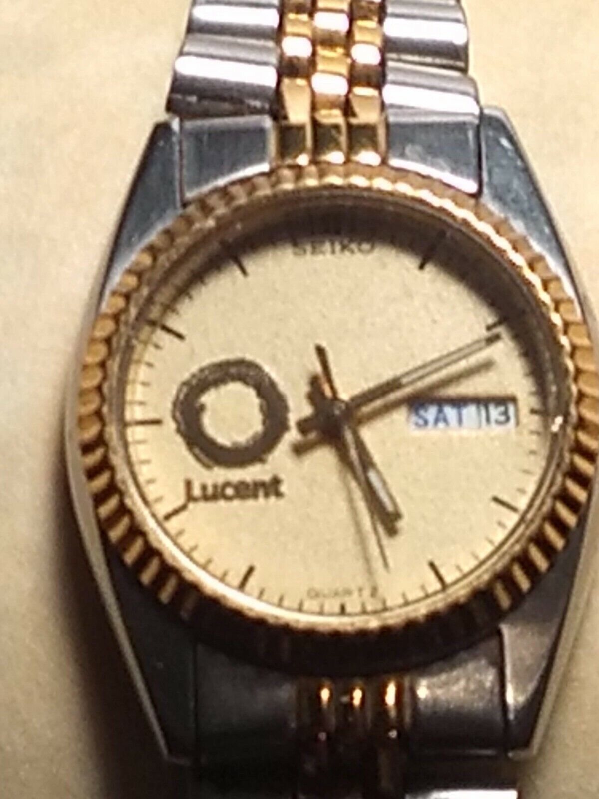 SEKIO woman's "lucent" commemorative watch, day and time, two tone band