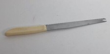 Vintage Quikut Serrated Carve & Serve Knife Cream Handle 7 1/2"Blade Made in USA