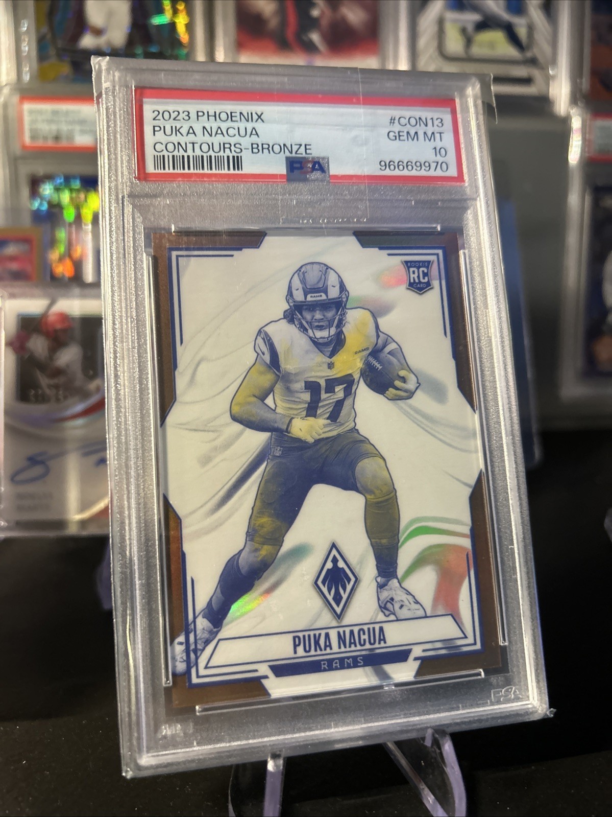 2023 Panini Phoenix Contours Bronze /50 Puka Nacua RC PSA 10