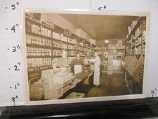 photo 1920s grocery store display Heinz ketchup Sunkist sign scale canned food