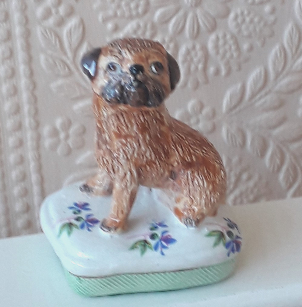 BASIL MATTHEWS POTTERY BORDER TERRIER SEATED ON A CUSHION DOG MODEL ORNAMENT