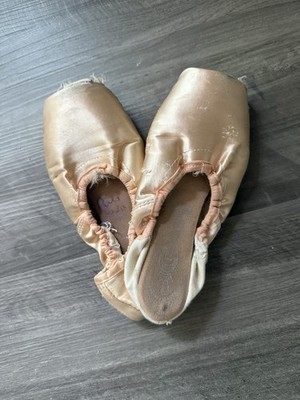 Well worn, used pointe shoes from a professional ballerina