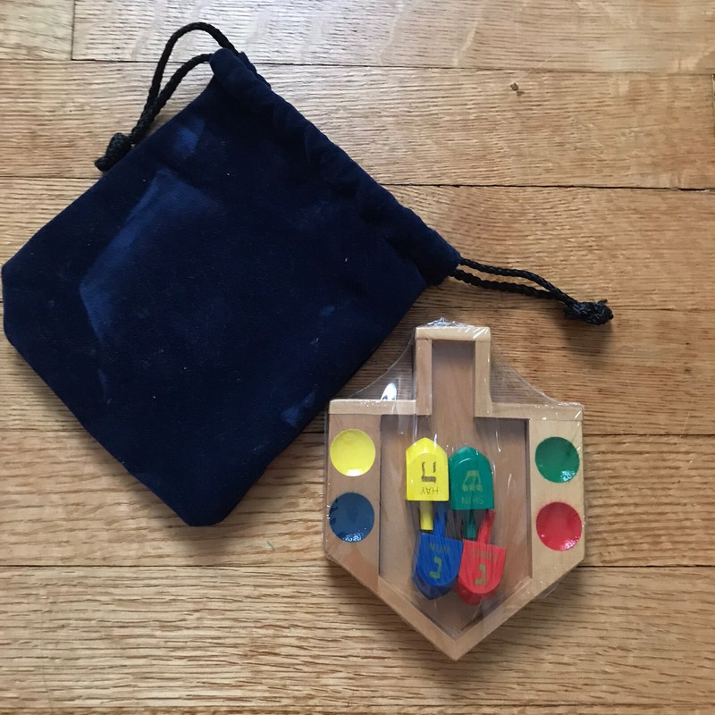 Wooden Travel Dreidel Hanukkah Game With Pouch display board primary colors