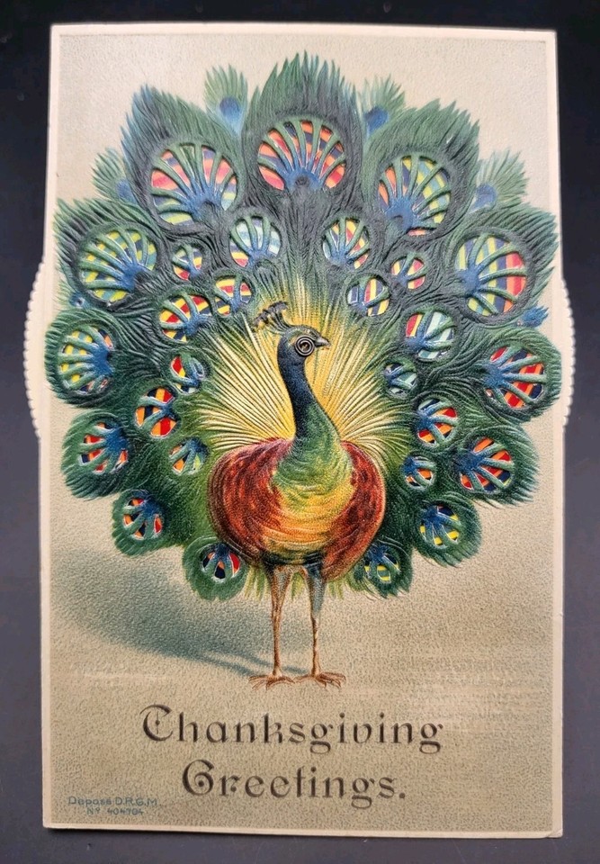A 1914 German mechanical peacock kaleidoscope postcard in excellent condition — the peacock literally moves, and it's over 100 years old.