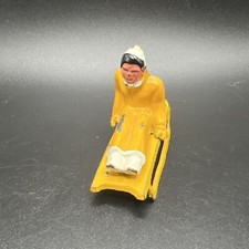 Vintage Manoil Barclay Woman on Sled Yellow Outfit Metal/Lead Figure 3"