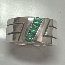 MJG STERLING SILVER WEDDING BAND. 3 LAB CREATED EMERALDS. 16 G. SZ 10 1/4