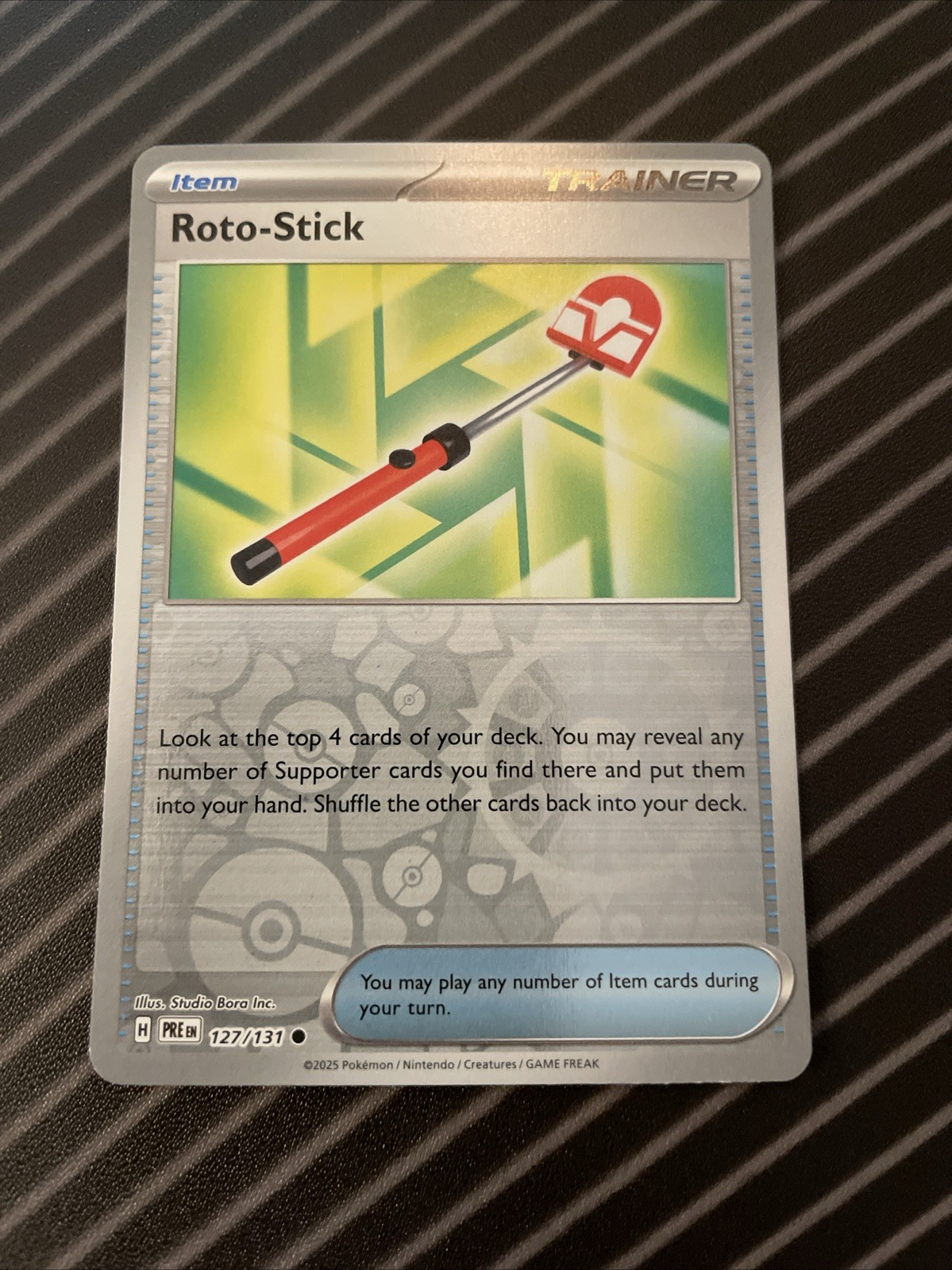 Roto-Stick 127/131 Reverse Holo - Near Mint - Prismatic Evolutions