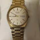 Seiko Quartz Unisex Analog Day/Date White Dial Gold Tone Metal Bracelet Watch