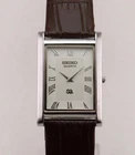 Vintage Seiko Slim Quartz Men's Wrist Watch White Dial with Dark Brown Strap.