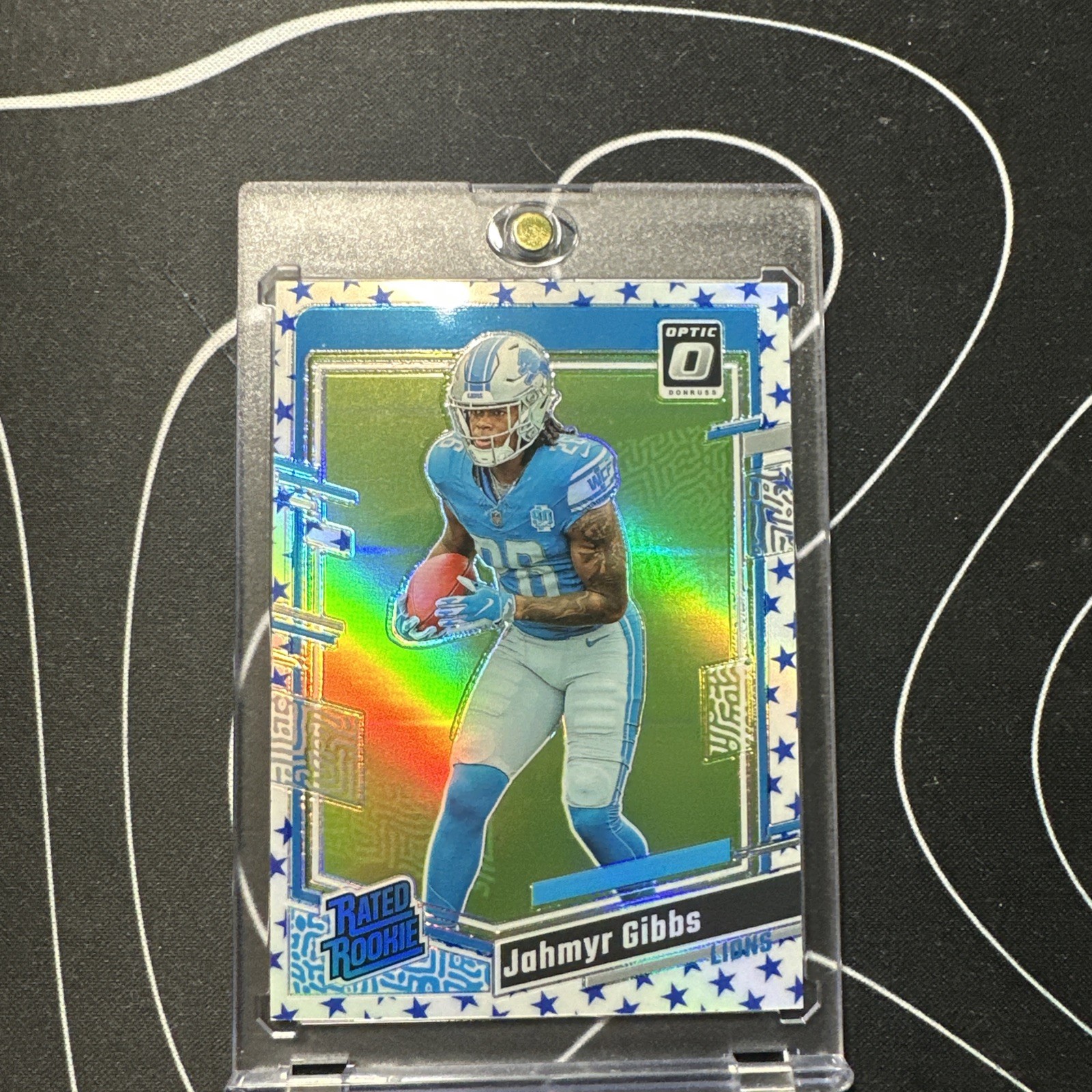 2023 Optic - Rated Rookie Jahmyr Gibbs #236 Stars Prizm Refractor (RC)
