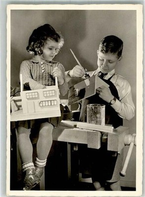 38133784 - Two Children Building a Dollhouse No. 318 EAS