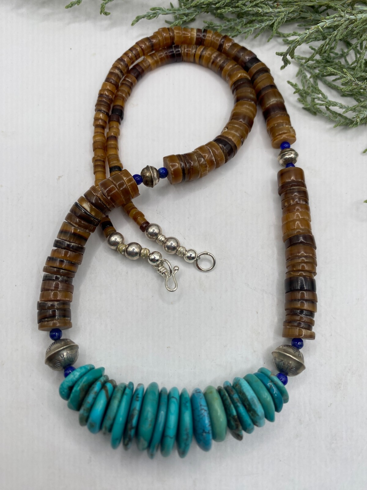 Native American golden brown penshell heishi bench be… - Gem