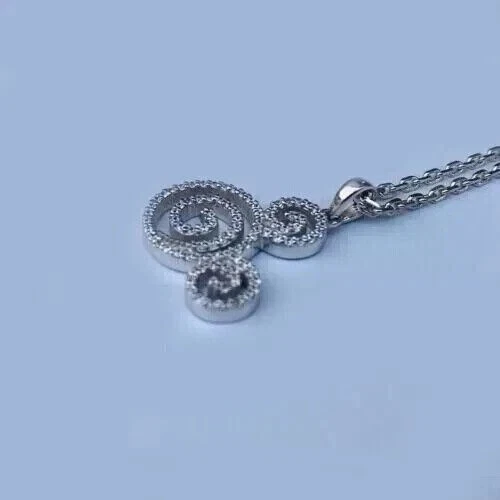 Colgante para mujer con remolino de diamantes simulados de corte redondo de 2,2 quilates enchapado en oro amarillo de 14 k Foto 4 de 4