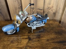 The object in the image is a vintage-style chopper motorcycle figurine