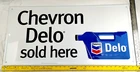 Vintage Chevron Delo 32” X 16” Embossed Advertising Sign - Aluminum- 1999 NOS