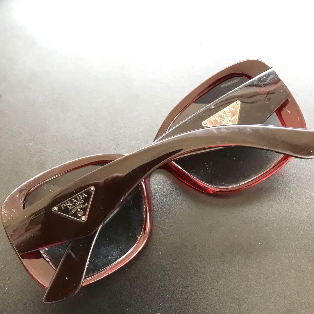 PRADA Sunglasses with Triangle Logo Plate Clear Red From PRADA Sunglasses with Triangle Logo Plate Clear Red From