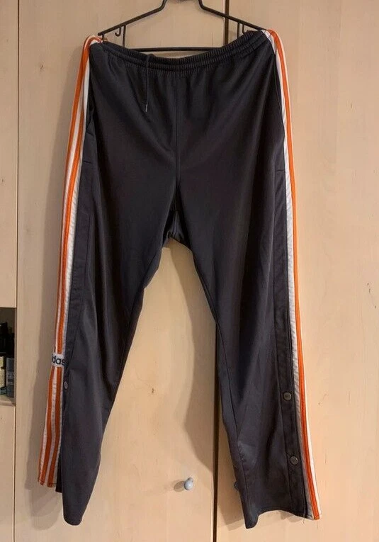 Adidas track pants orange best sale stripe