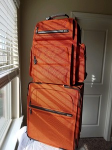tumi orange backpack