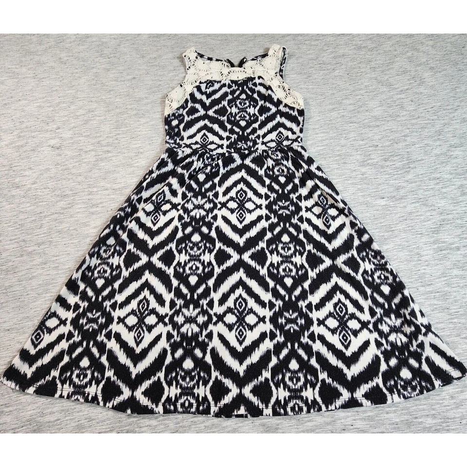 Vestido A Line Detalle Encaje Sobre la Rodilla Mini Sin Mangas Juniors Talla XS Negro Blanco Foto 2 de 4