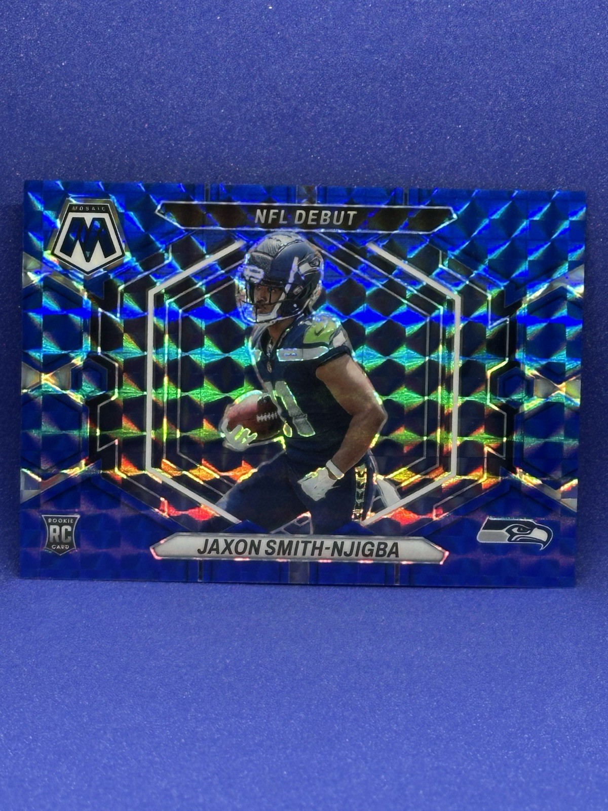 2023 Mosaic - Nfl Debut Jaxon Smith-Njigba #ND-12 Blue Mosaic Prizm /99 (RC)