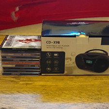 Brand New Portable CD Player And 10 CDs