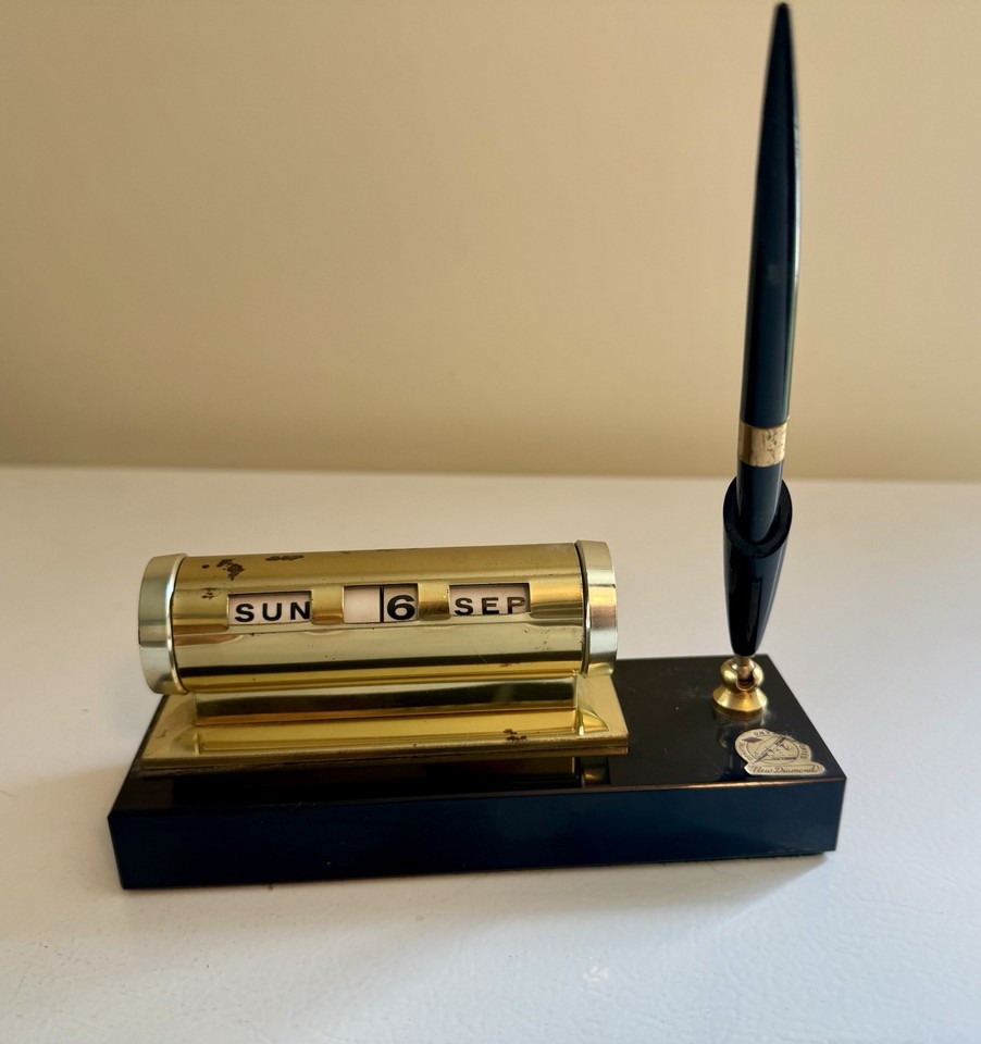 A mid-century onyx base perpetual roll calendar with pen stand — the kind of desk set that makes you feel like you're closing deals in 1962.