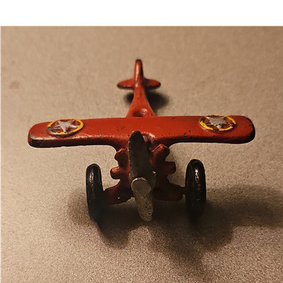 Vintage Cast Iron Red Toy Airplane with Star Design