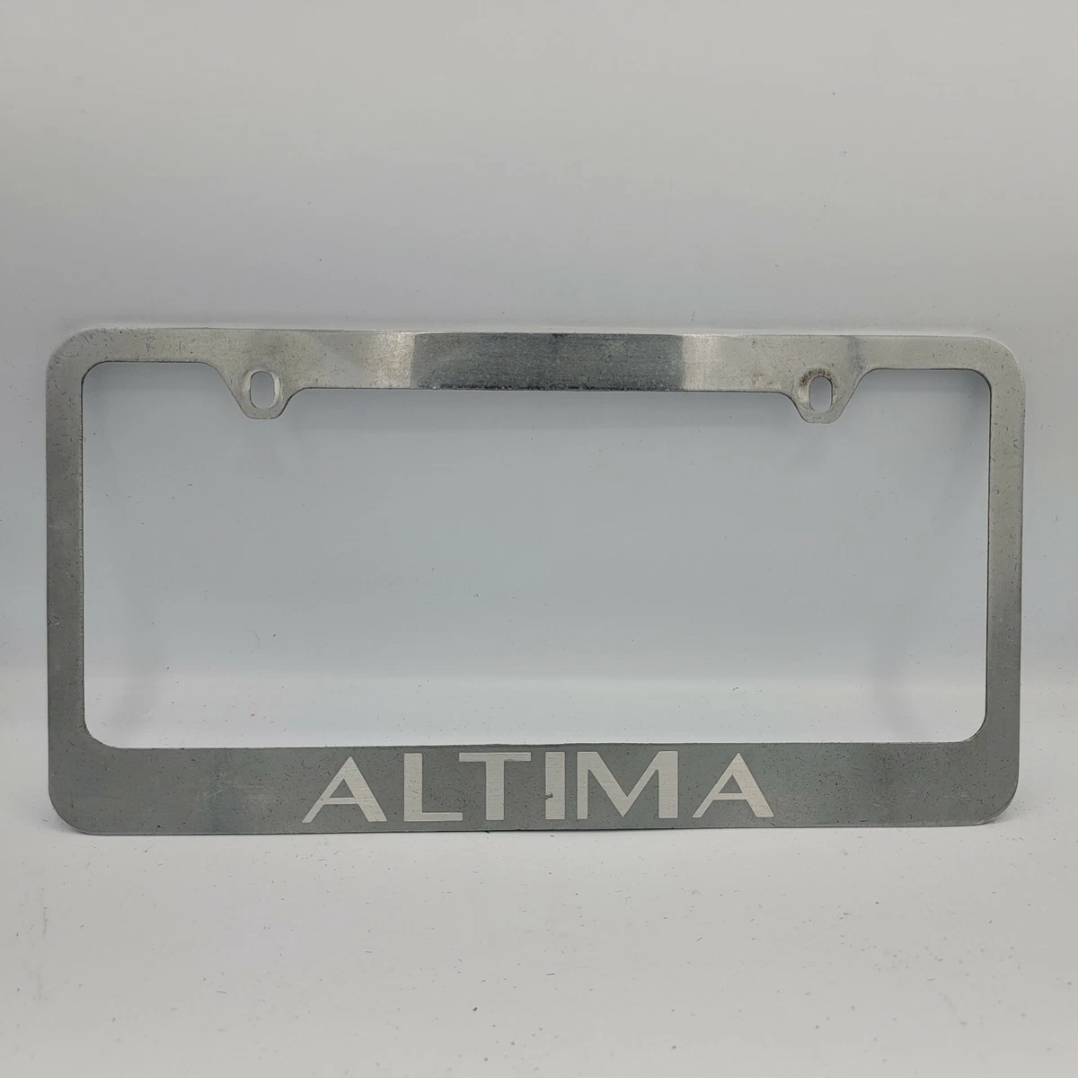 Nissan Altima Make Logo Metal Silver License Plate Frame Holder