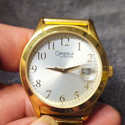 Caravelle by Bulova Quartz Watch Silver Dial Date Gold Bracelet 30m Dress