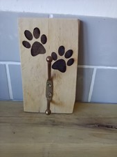 Wall hooks, natural wood backing, paw prints image, with two hooks.